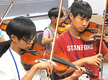 two boys playing violin