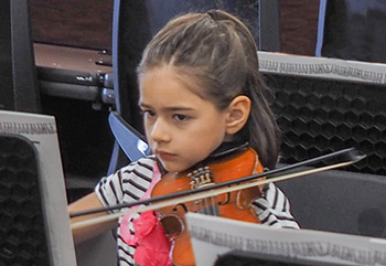 Small girl playing violin