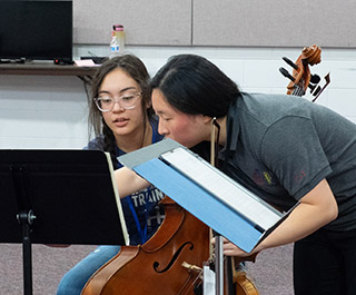 teacher with cello student