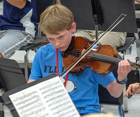 Boy reading music