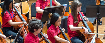 young people playing cellos