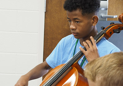 Young man playing cello