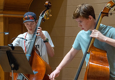 Students playing bass