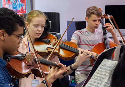 students playing violins and cello