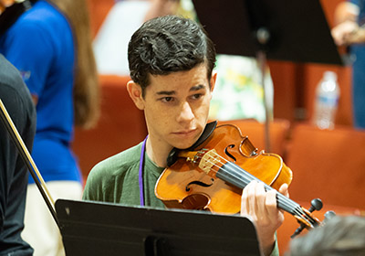 Young man playing violin