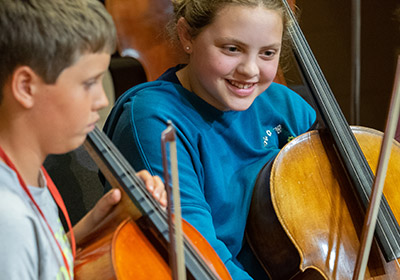 children playing cellos