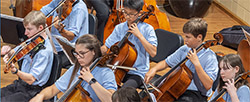 young people playing cellos