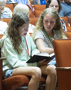 two girls singing