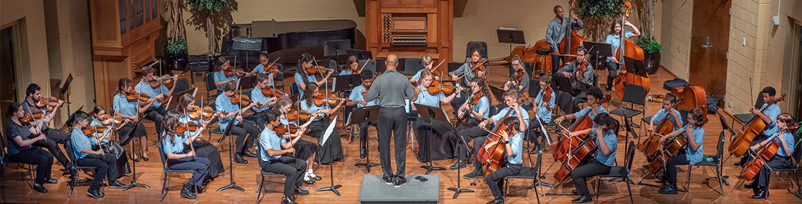 young people playing in a string orchestra