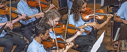 Young people playing violins