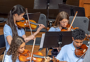 Young people playing violins