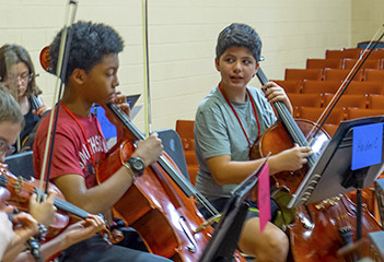 Boys playing cellos