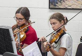 Girls playing violins