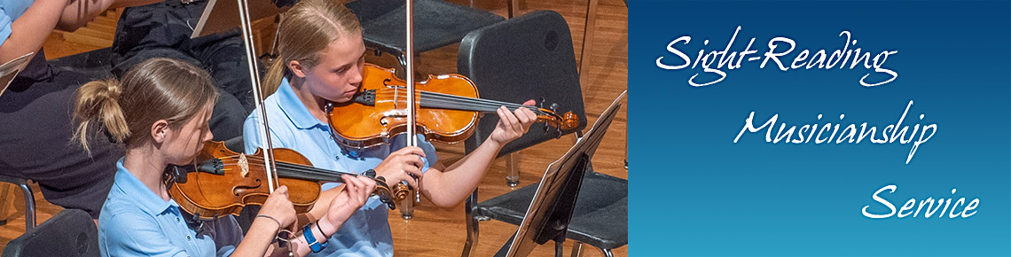 two girls playing violin