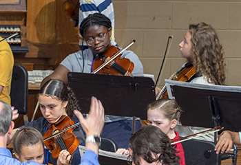 Young people playing in orchestra