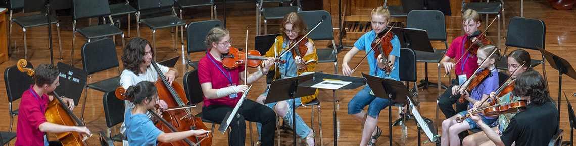 young people in orchestra rehearsal