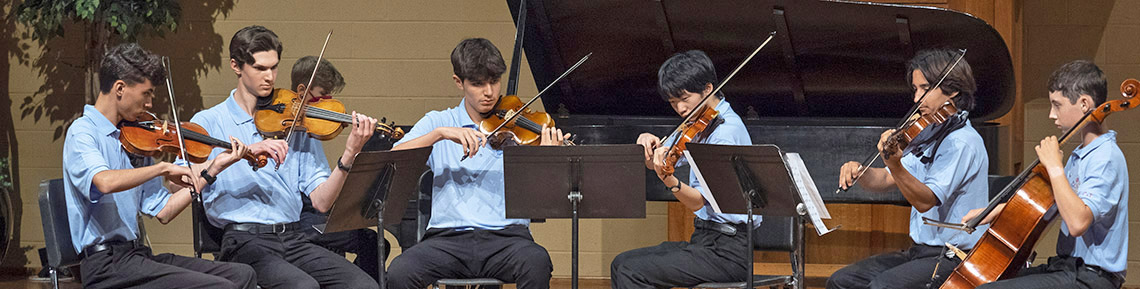 young men playing piano quintet