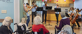 young people playing for seniors