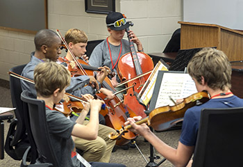 boys playing string music