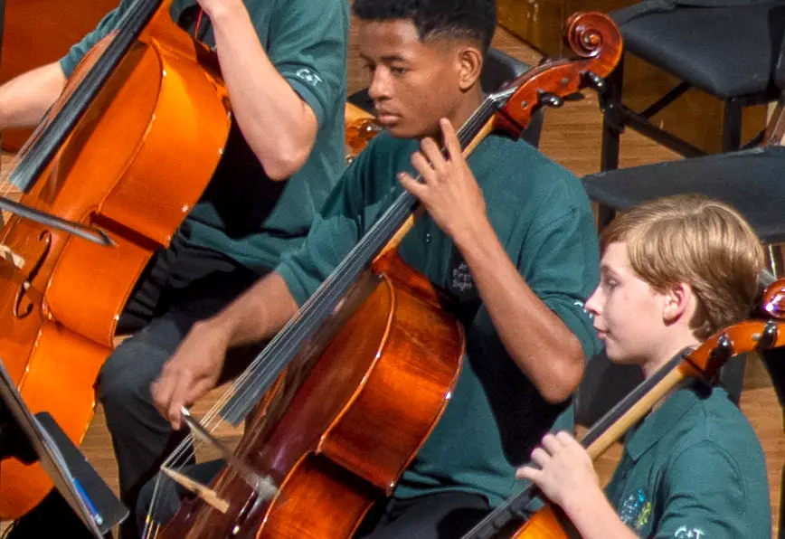 2 boys playing cellos