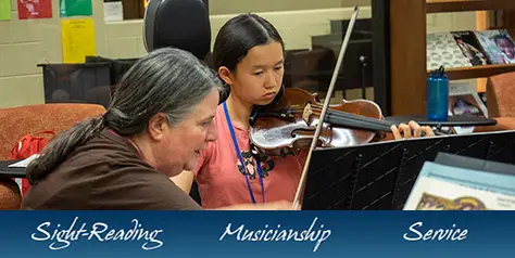 banner-teacher helping student