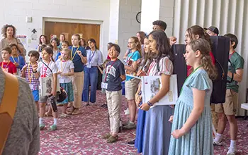 students gather for "sung grace"